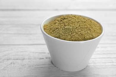 Photo of Hemp protein powder in bowl on table. Superfood