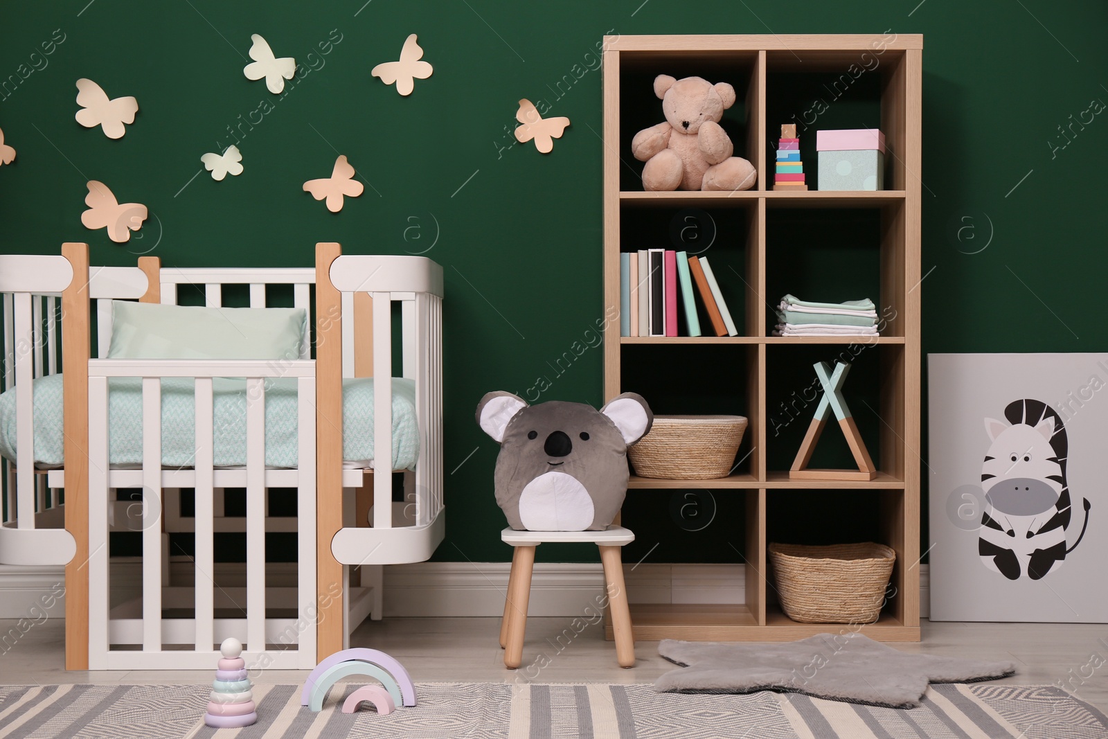 Photo of Beautiful baby room interior with stylish furniture and comfortable crib