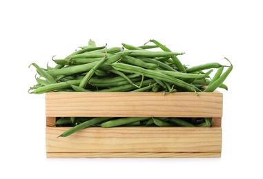 Photo of Fresh green beans in wooden crate on white background