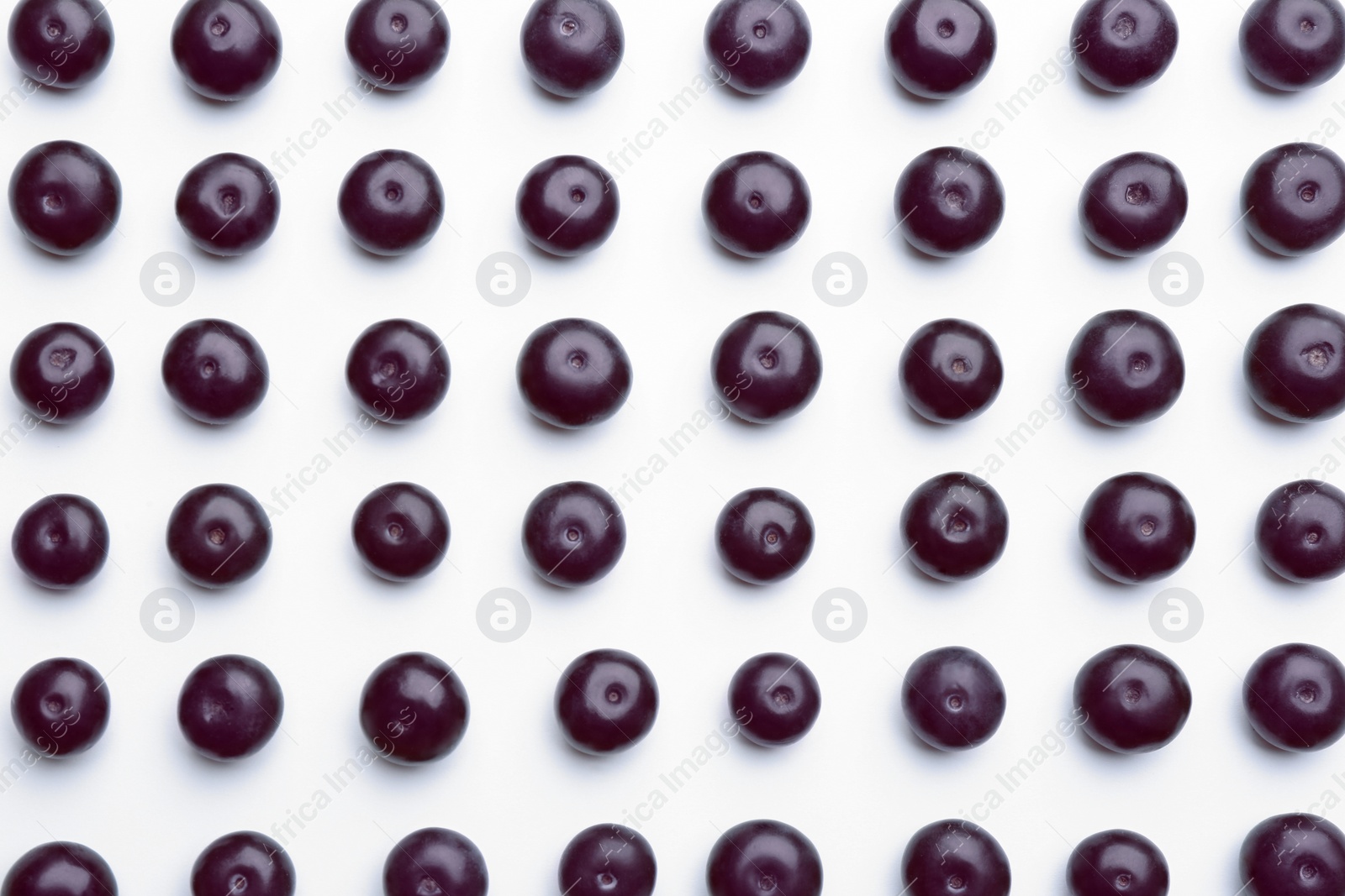 Photo of Fresh acai berries on white background, top view