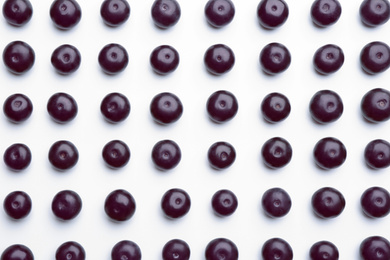 Fresh acai berries on white background, top view