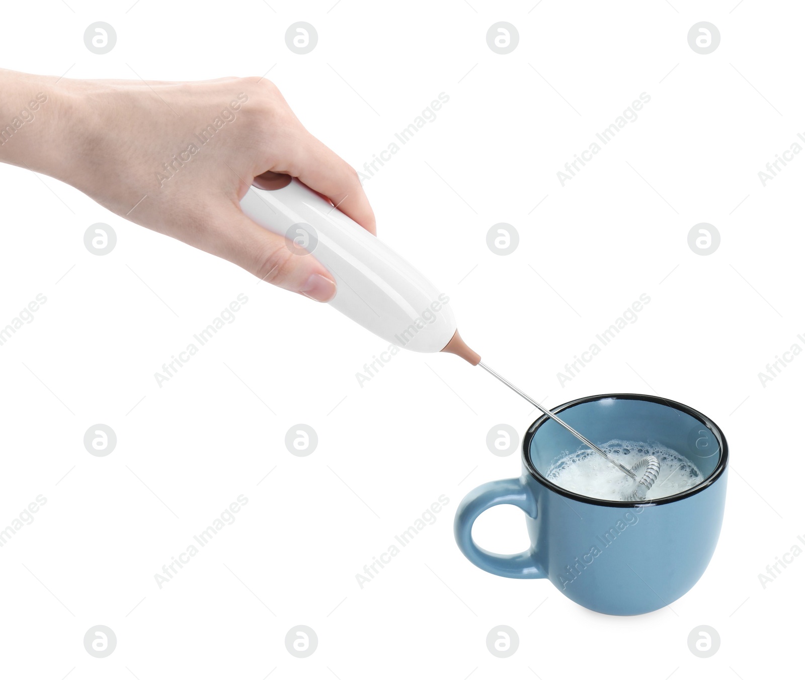 Photo of Woman whisking milk in cup with mini mixer (frother wand) isolated on white