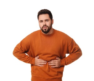 Photo of Young man suffering from stomach pain on white background