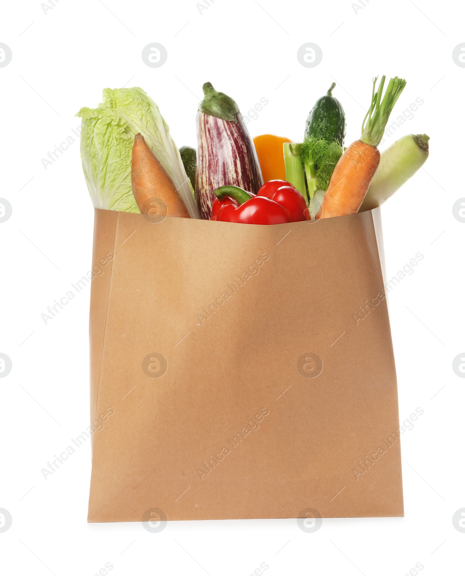 Photo of Paper bag with vegetables on white background