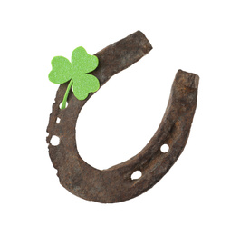 Old horseshoe and clover on white background. St. Patrick's Day celebration