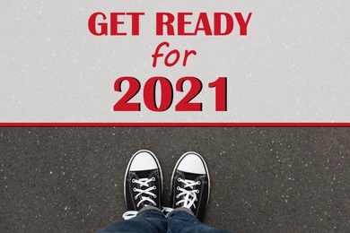 Image of Text Get Ready For 2021 on asphalt in front of woman, top view