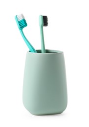Photo of Bath accessory. Ceramic holder with toothbrushes isolated on white