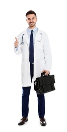 Full length portrait of medical doctor with bag isolated on white