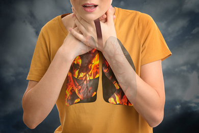 Image of Woman with diseased lungs coughing on grey background