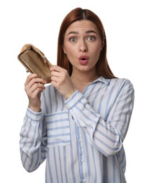 Photo of Confused woman with empty wallet on white background