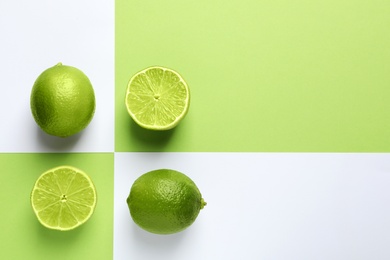 Flat lay composition with fresh limes on color background