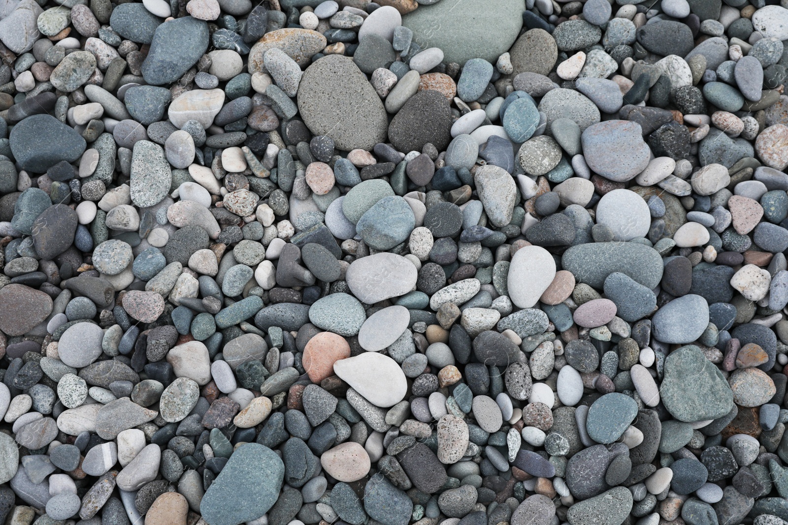 Photo of Many different pebbles as background, top view