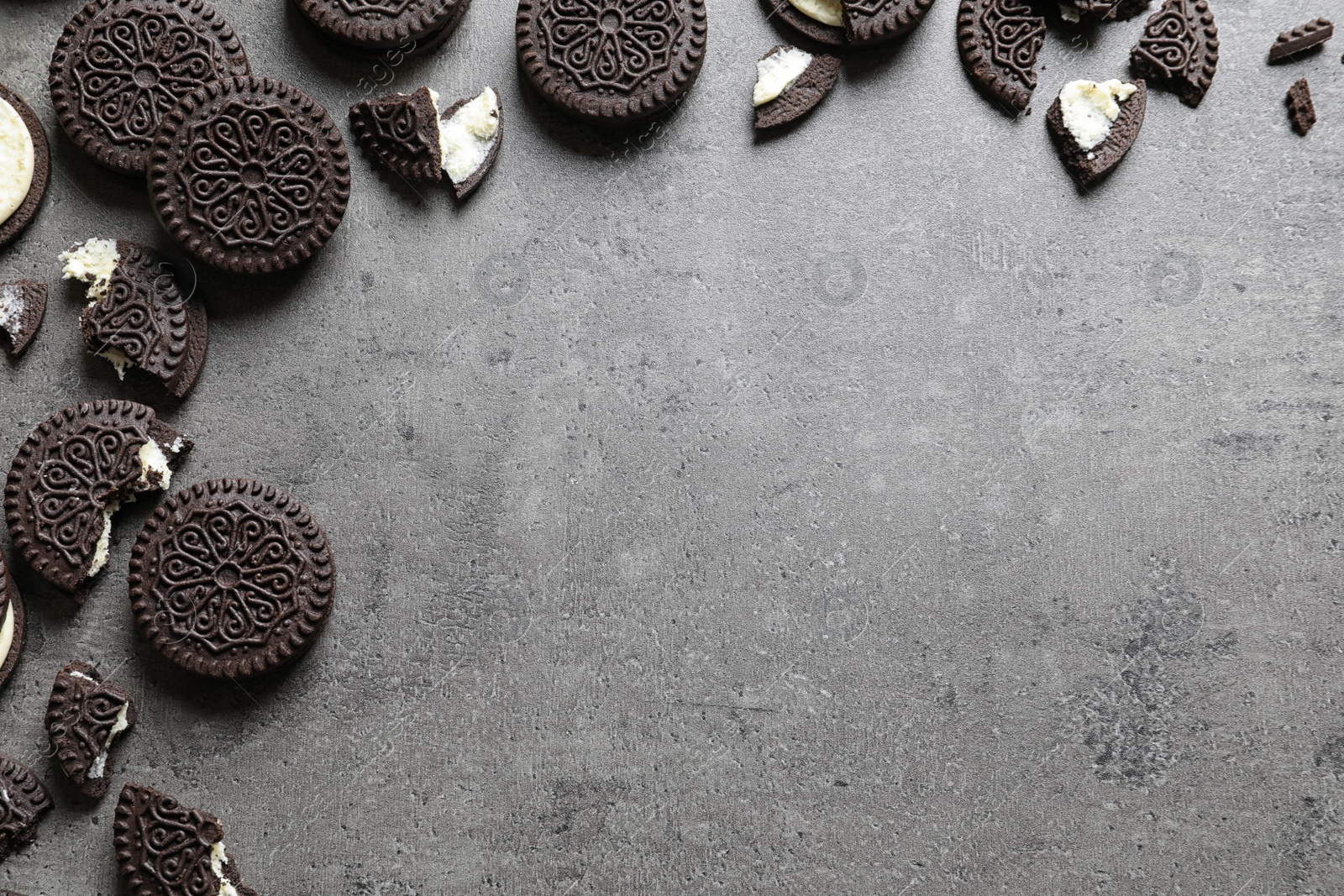 Photo of Tasty chocolate cookies on grey background, flat lay with space for text