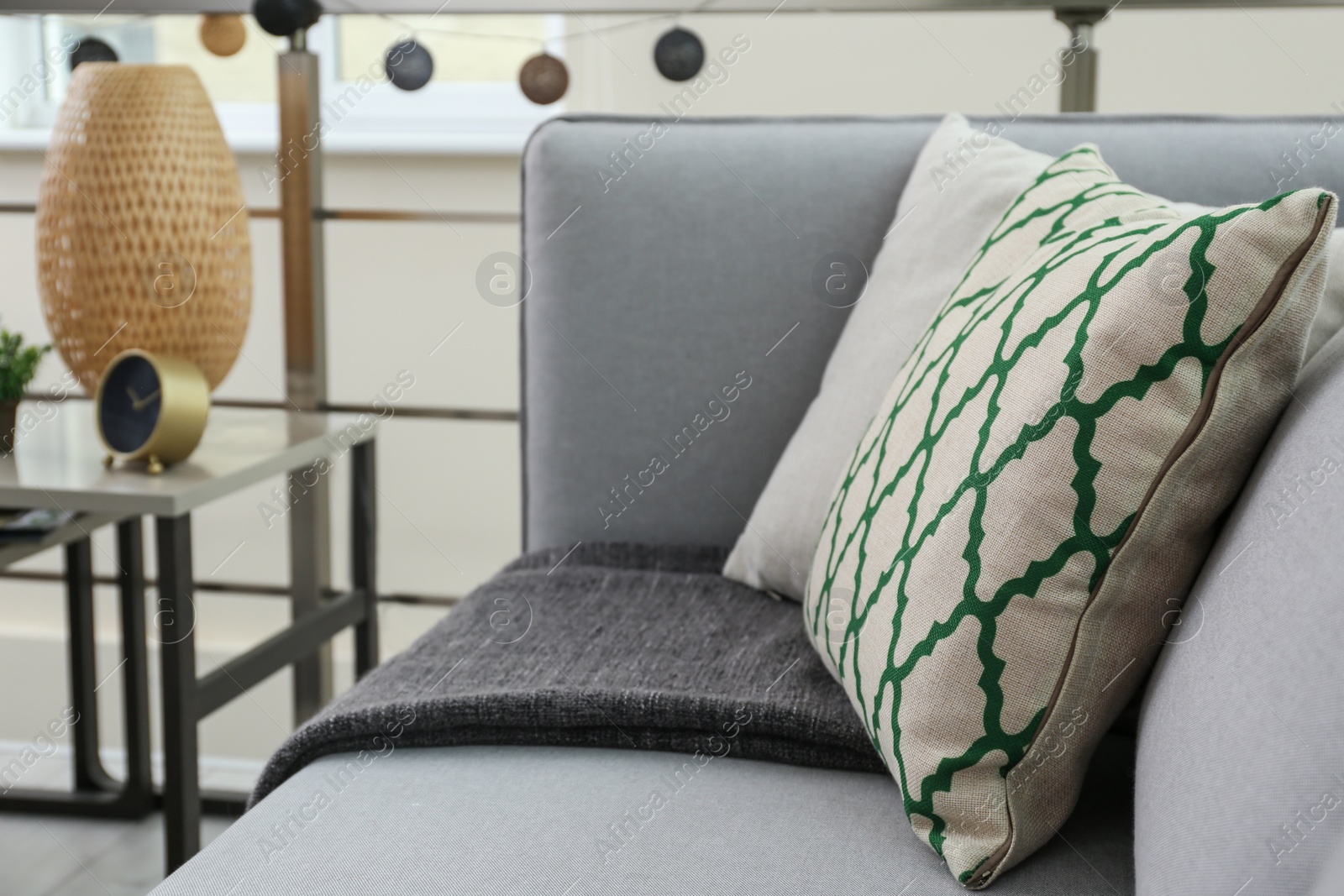 Photo of Comfortable sofa with pillows in living room