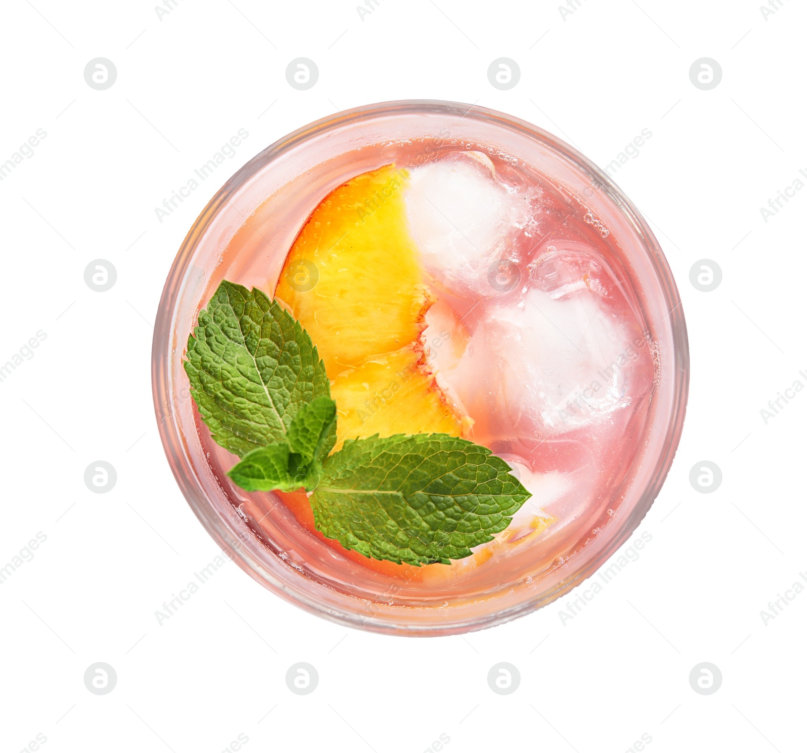 Photo of Peach cocktail in glass on white background, top view. Refreshing drink