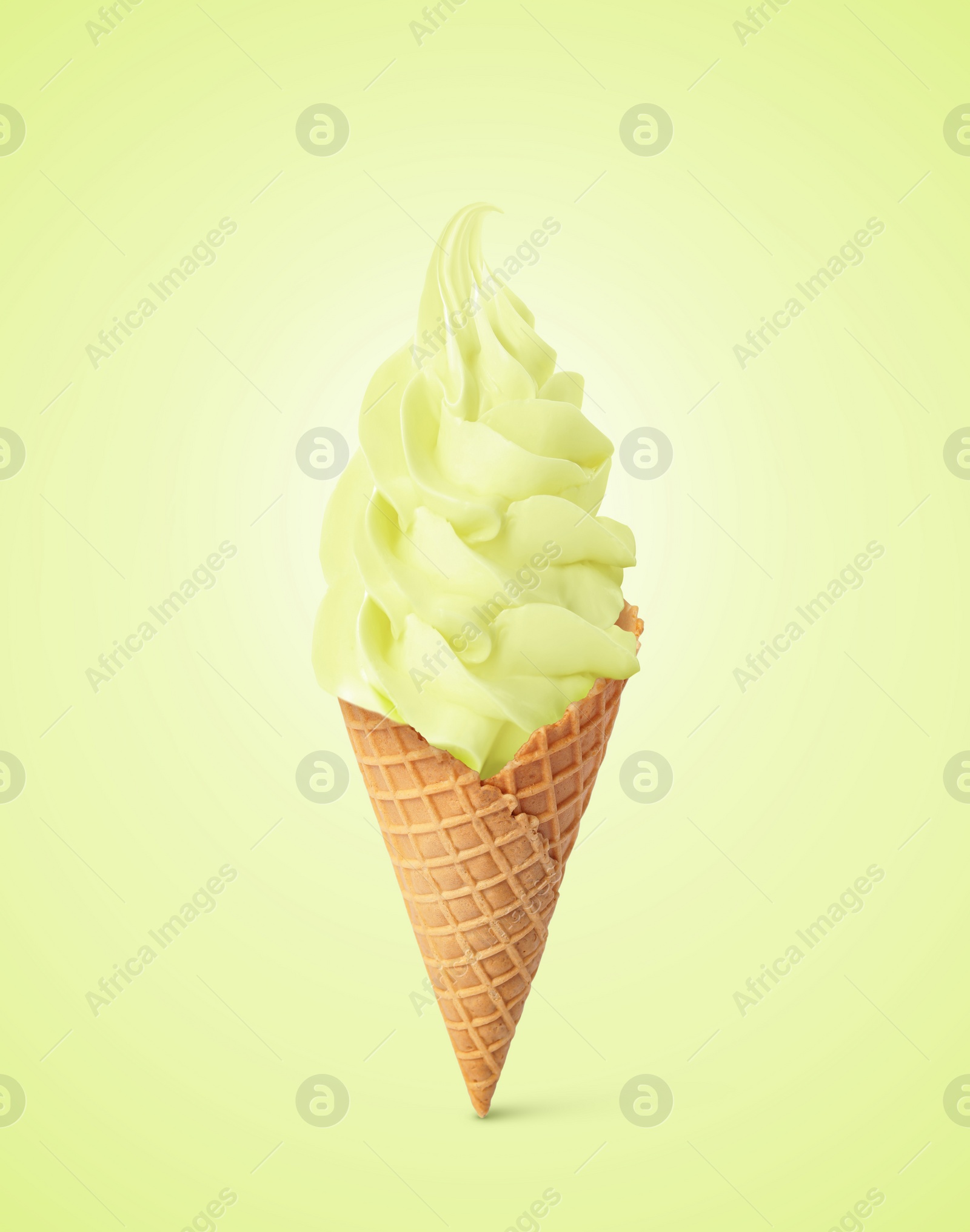 Image of Tasty ice cream in waffle cone on pastel green yellow background. Soft serve