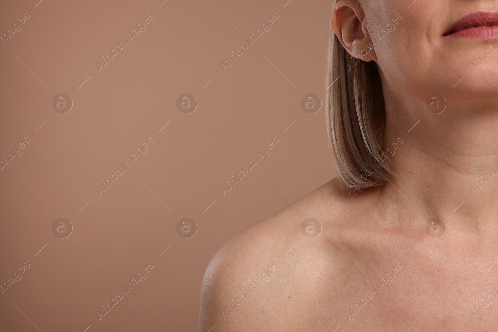 Photo of Woman with healthy skin on beige background, closeup. Space for text