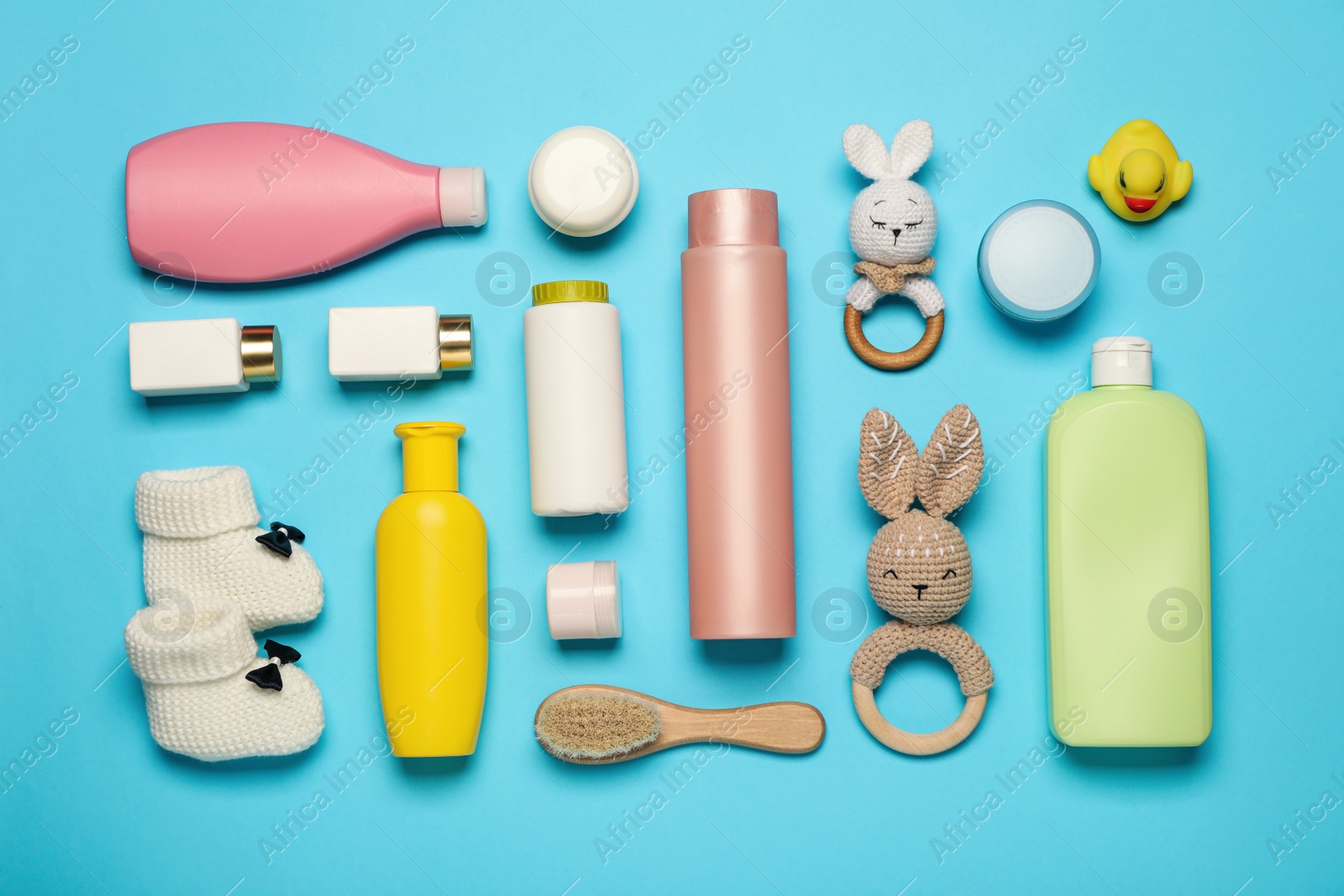 Photo of Flat lay composition with baby cosmetic products on light blue background