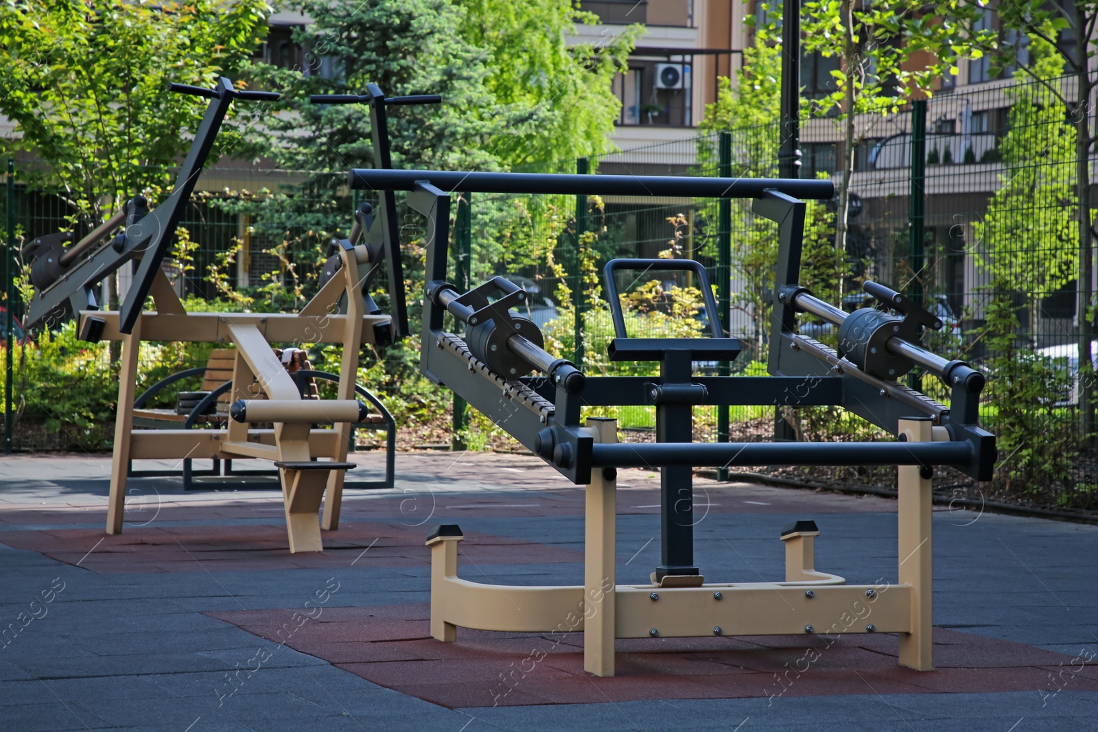 Photo of Empty outdoor gym with exercise simulator in residential area