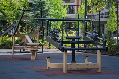 Empty outdoor gym with exercise simulator in residential area