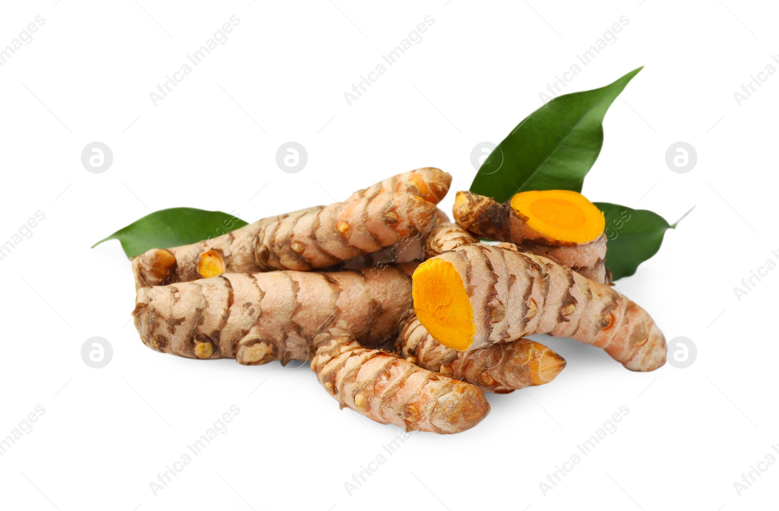 Photo of Fresh turmeric roots and green leaves isolated on white