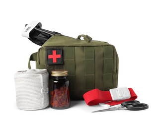 Photo of Military first aid kit, tourniquet, pills and tools on white background