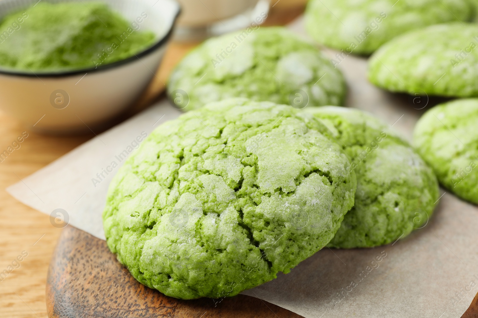 Photo of Tasty matcha cookies on wooden table, closeup