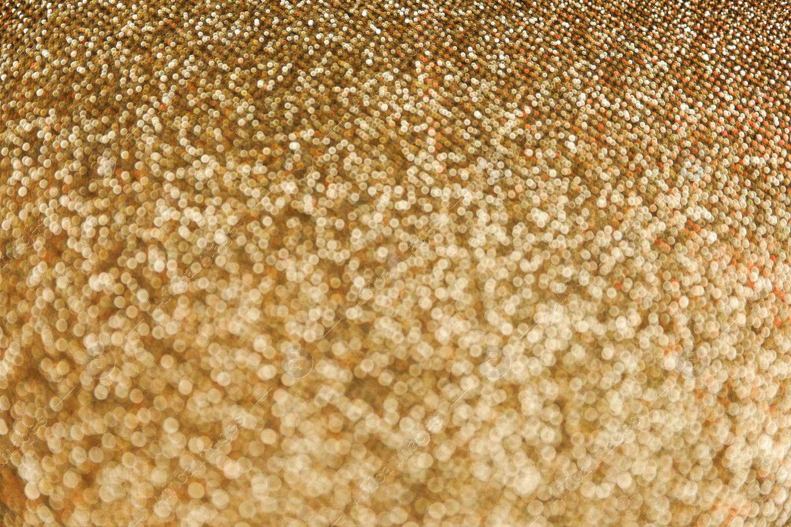 Photo of Gold glitter with bokeh effect as background, closeup
