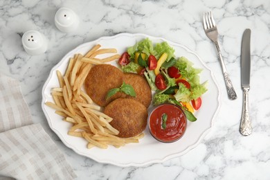 Photo of Delicious fried breaded cutlets with garnish served on white marble table, flat lay