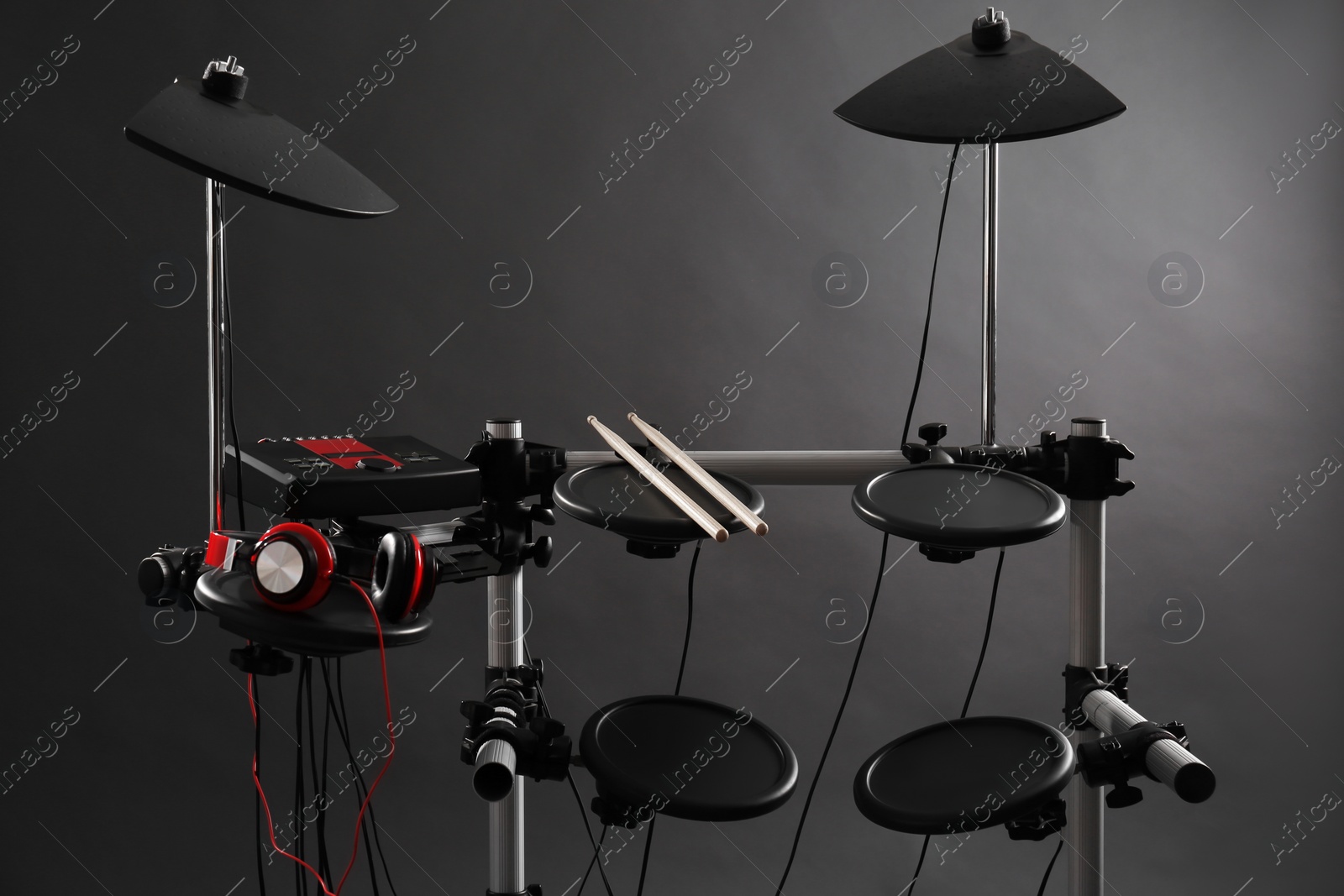 Photo of Modern electronic drum kit on grey background. Musical instrument