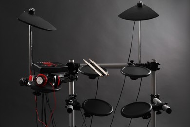 Photo of Modern electronic drum kit on grey background. Musical instrument