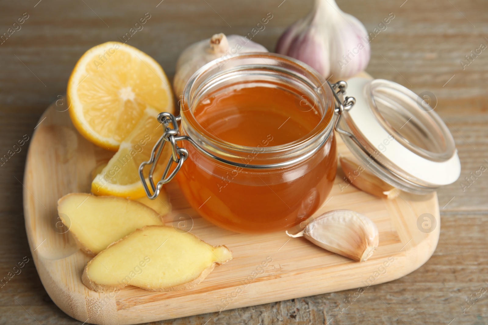 Photo of Cold remedies on wooden table. Sore throat treatment