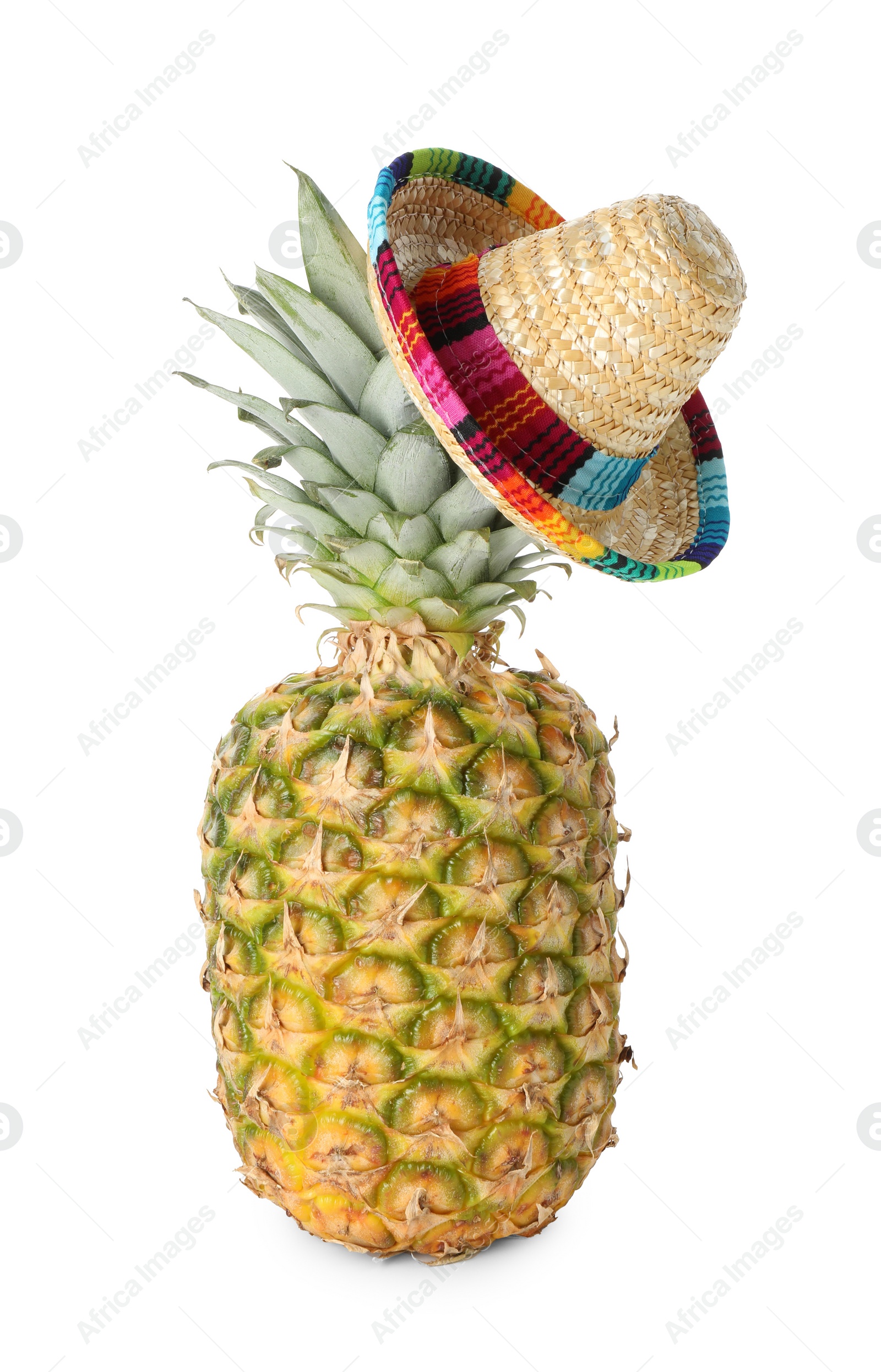 Photo of Pineapple with Mexican sombrero hat isolated on white