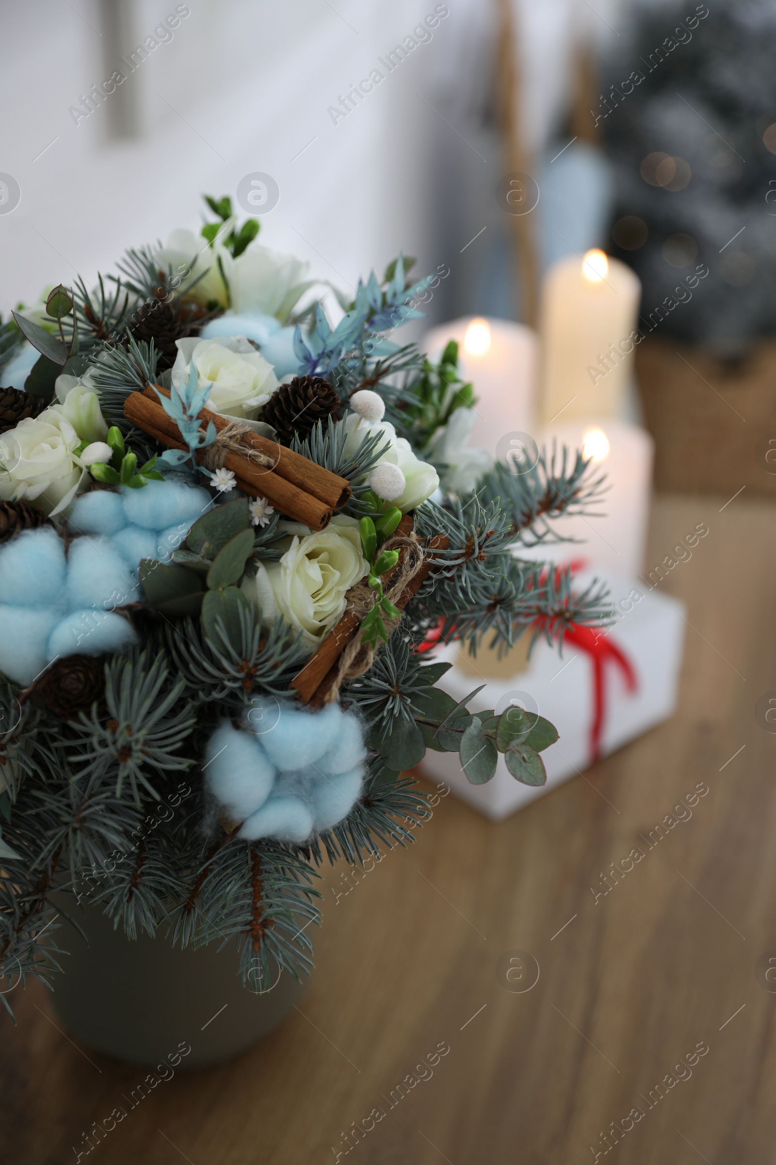 Photo of Beautiful wedding winter bouquet on wooden table indoors