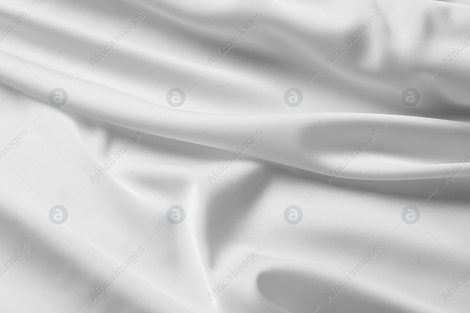 Photo of Texture of white silk ripple fabric as background, top view