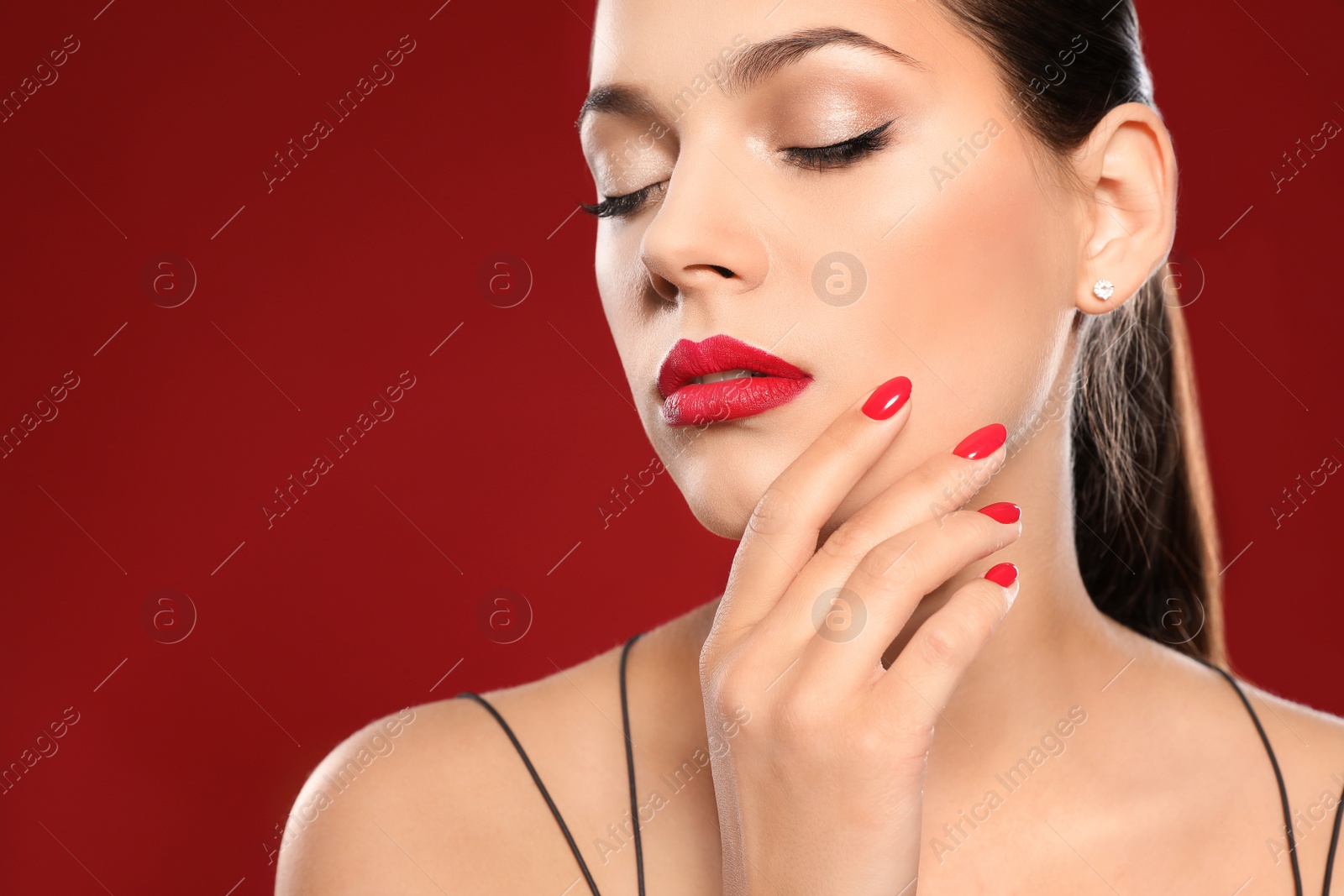Photo of Beautiful young woman with bright manicure on color background, space for text. Nail polish trends
