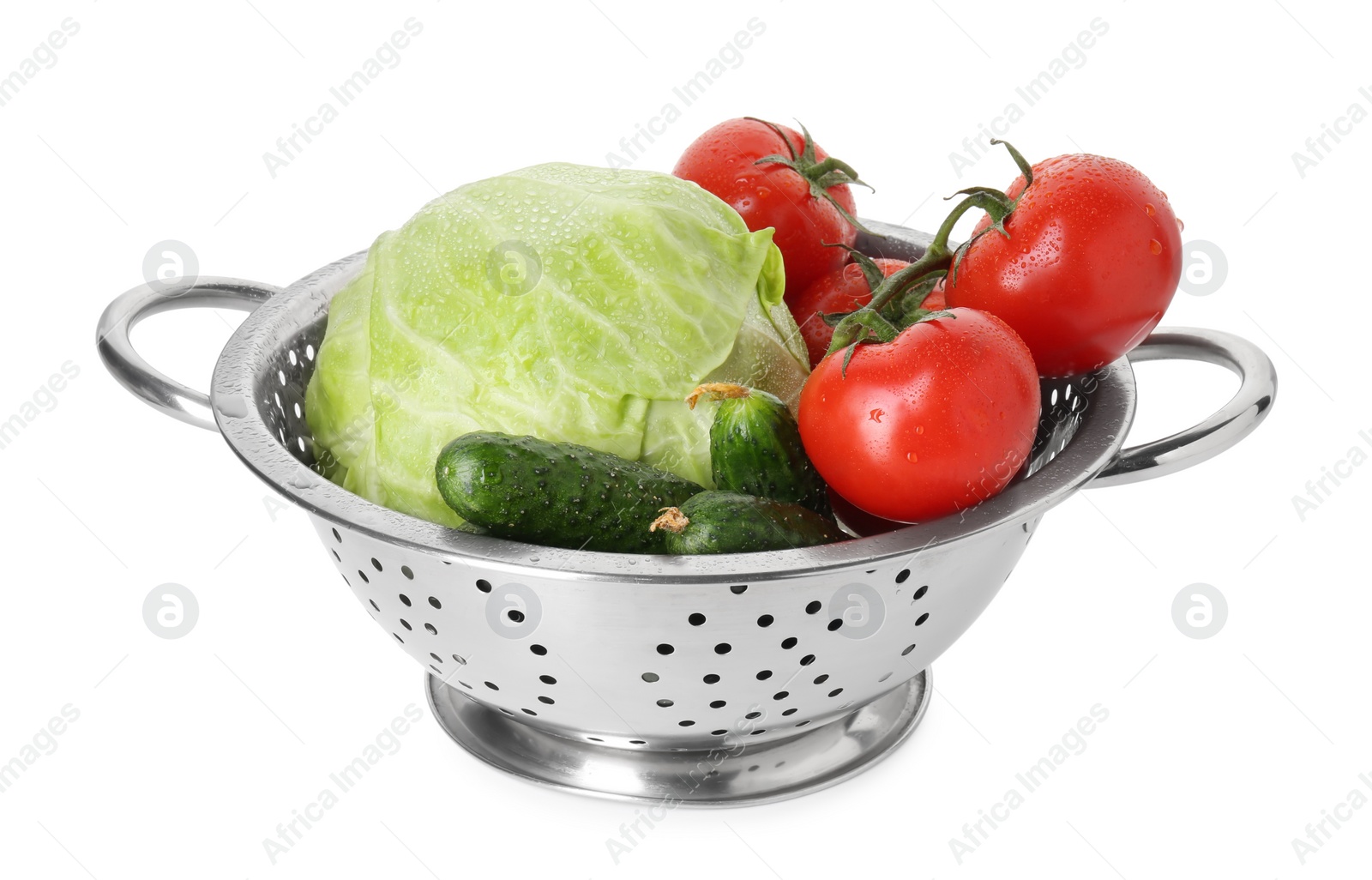 Photo of Metal colander with different vegetables isolated on white