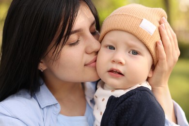 Photo of Family portrait of mother and her baby on blurred background, closeup