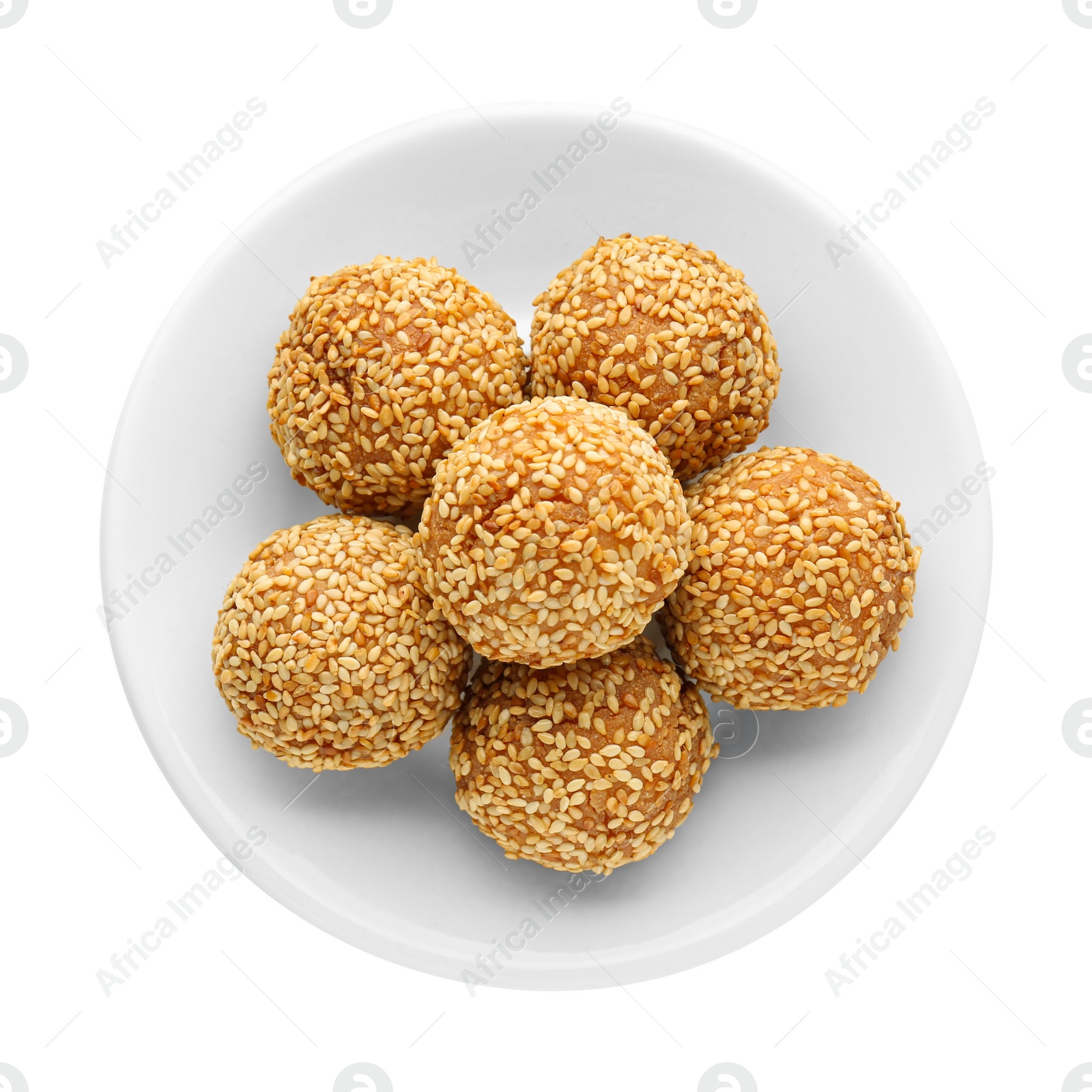 Photo of Plate of delicious sesame balls on white background, top view