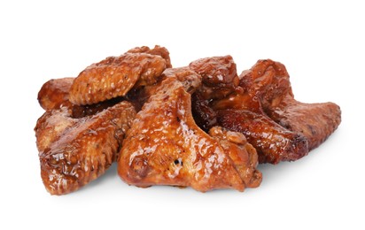 Photo of Pile of chicken wings glazed with soy sauce isolated on white