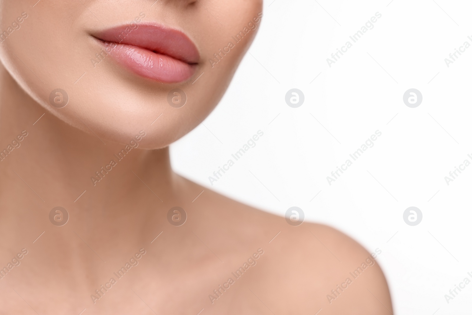 Photo of Woman with beautiful lips on white background, closeup. Space for text