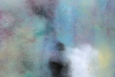 Photo of Texture of abstract spray paint as background, top view