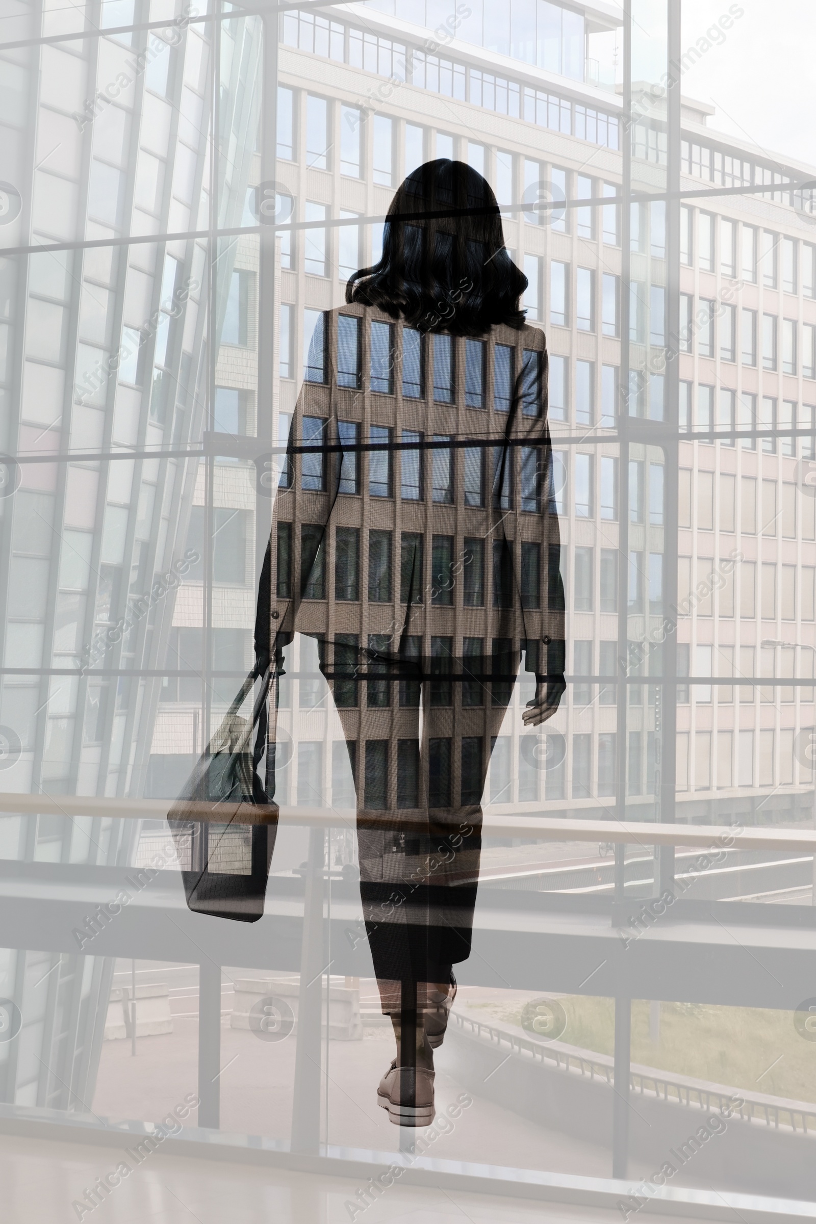 Image of Double exposure of businesswoman and cityscape with office buildings