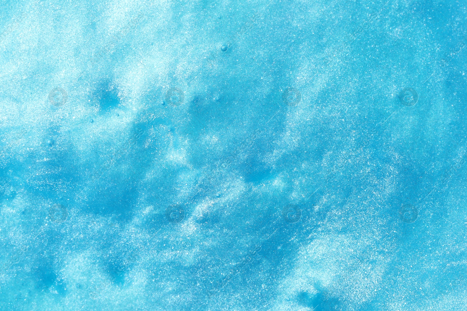 Photo of Closeup view of blue slime as background. Antistress toy