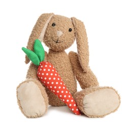 Photo of Adorable toy bunny and carrot on white background