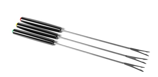 Photo of Set of fondue forks on white background. Kitchen equipment