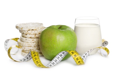 Healthy food and measuring tape on white background. Concept of weight loss