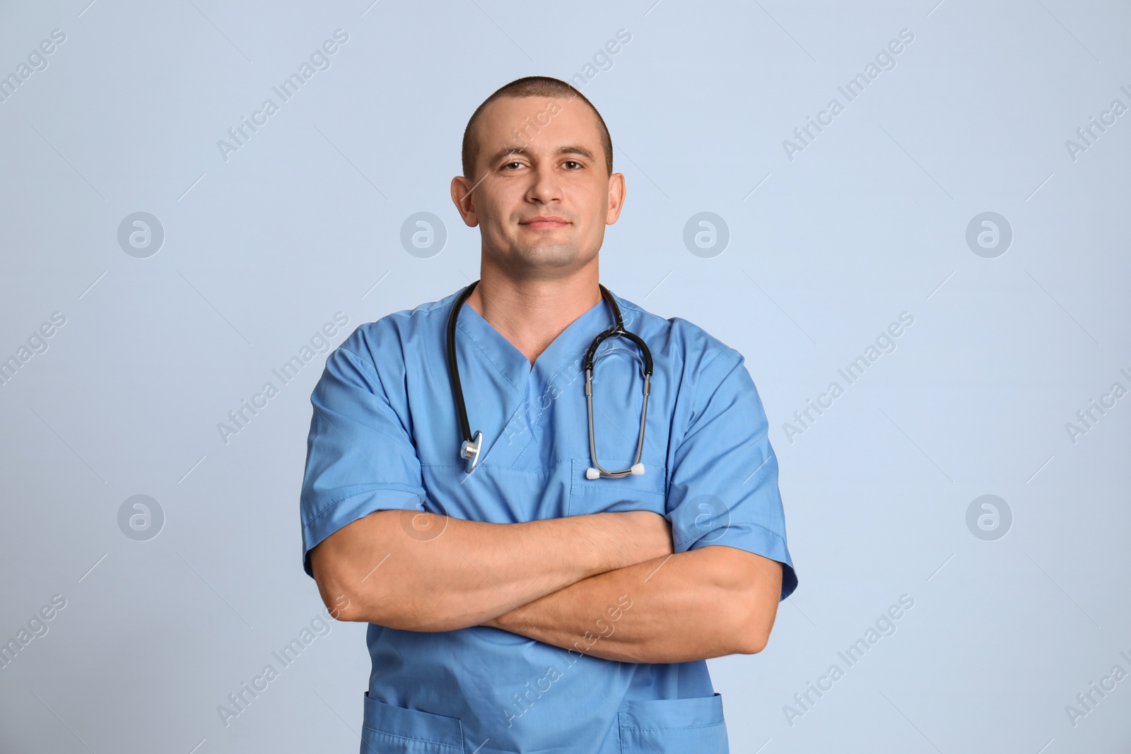 Photo of Portrait of medical assistant with stethoscope on color background