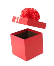 Red gift box and lid with bow on white background