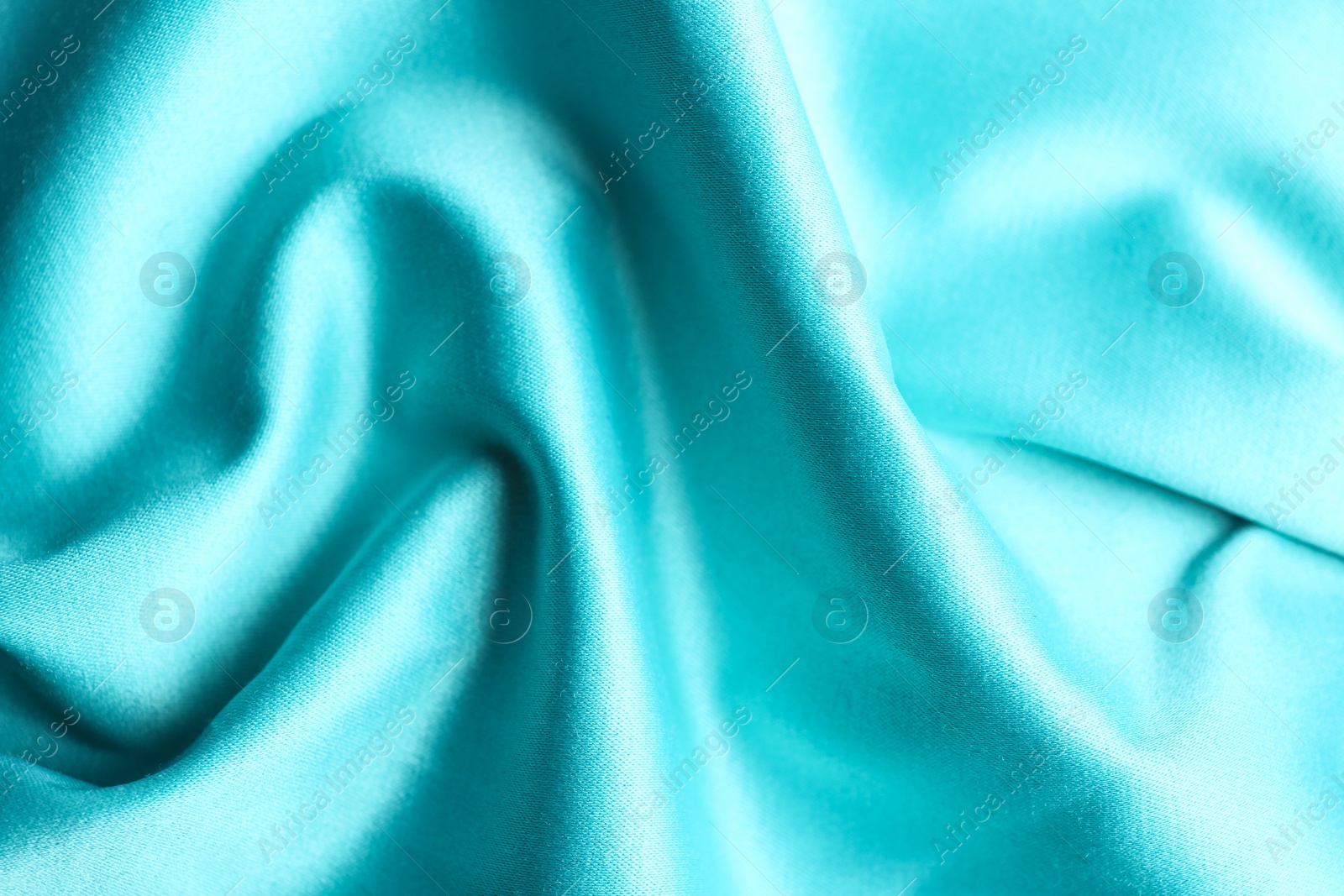 Photo of Texture of delicate light blue fabric as background, closeup